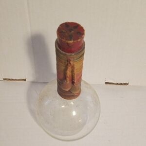 Decorative Glass Bottle with Red and Brown Accents